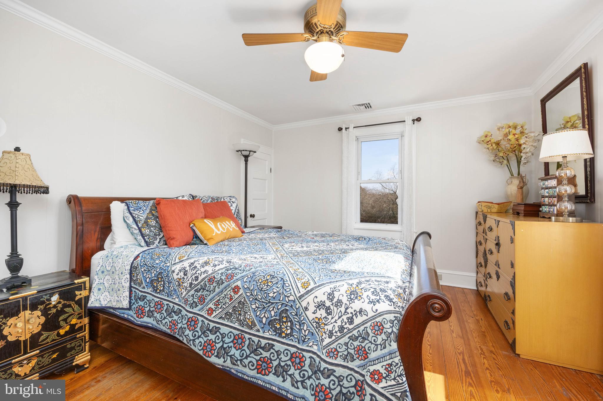 4569 Tyaskin Road Tyaskin, MD 21865 - Photo 29 of 98 a bedroom with bed and a chandelier