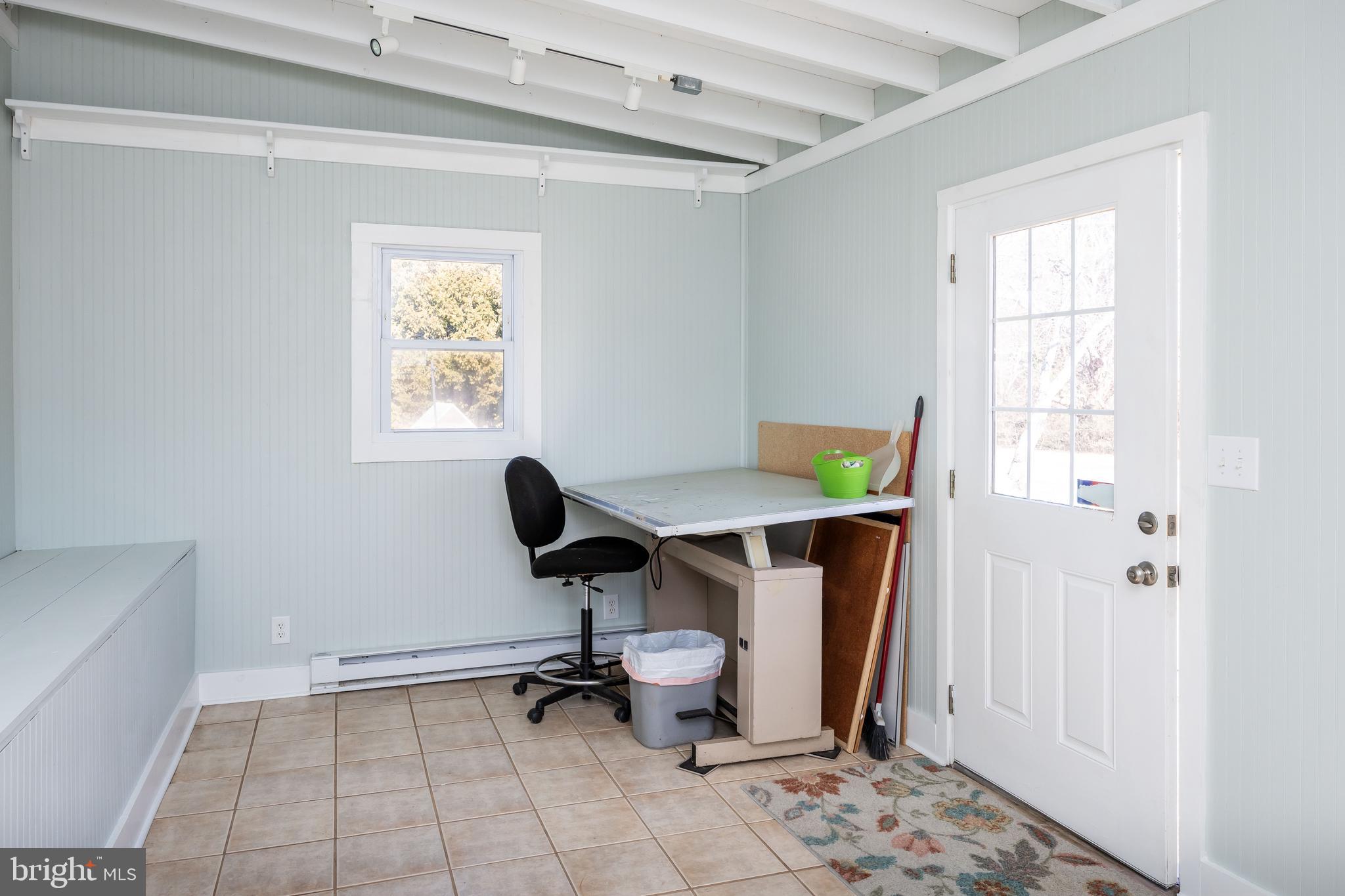 4569 Tyaskin Road Tyaskin, MD 21865 - Photo 55 of 98 a view of a hallway with wooden floor and a window