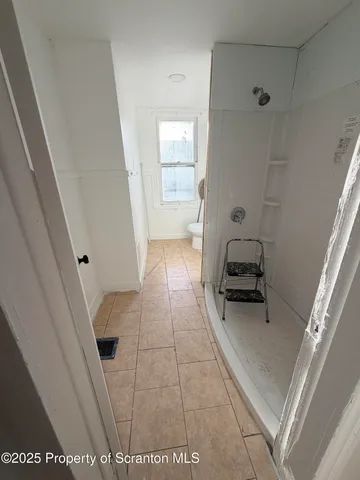 a kitchen with a sink a stove and a window