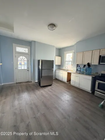 a view of kitchen with furniture and window