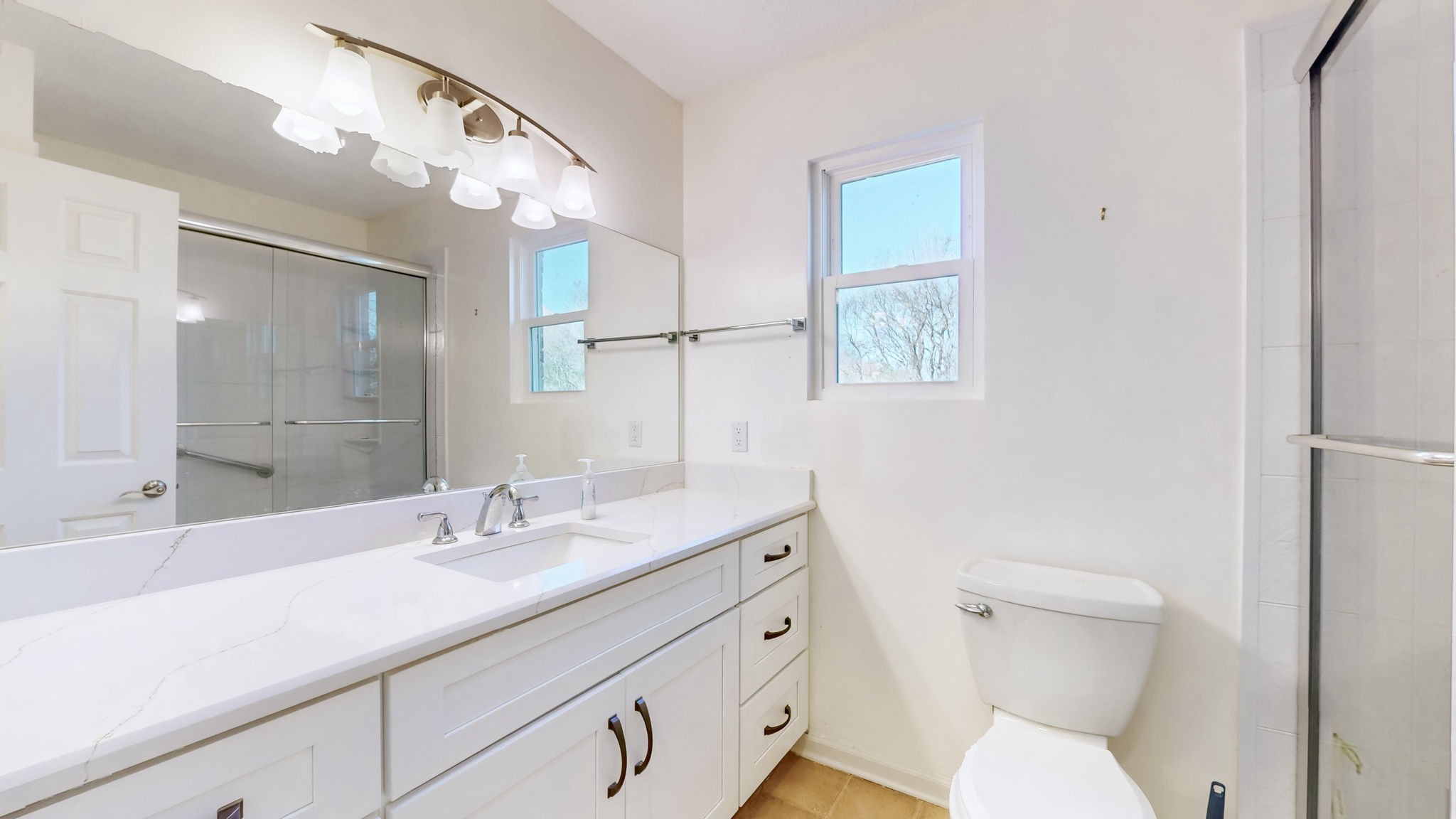 120 3 Fork Bridge Road Wartrace, TN 37183 - Photo 24 of 48 a bathroom with a sink a toilet a large mirror and vanity
