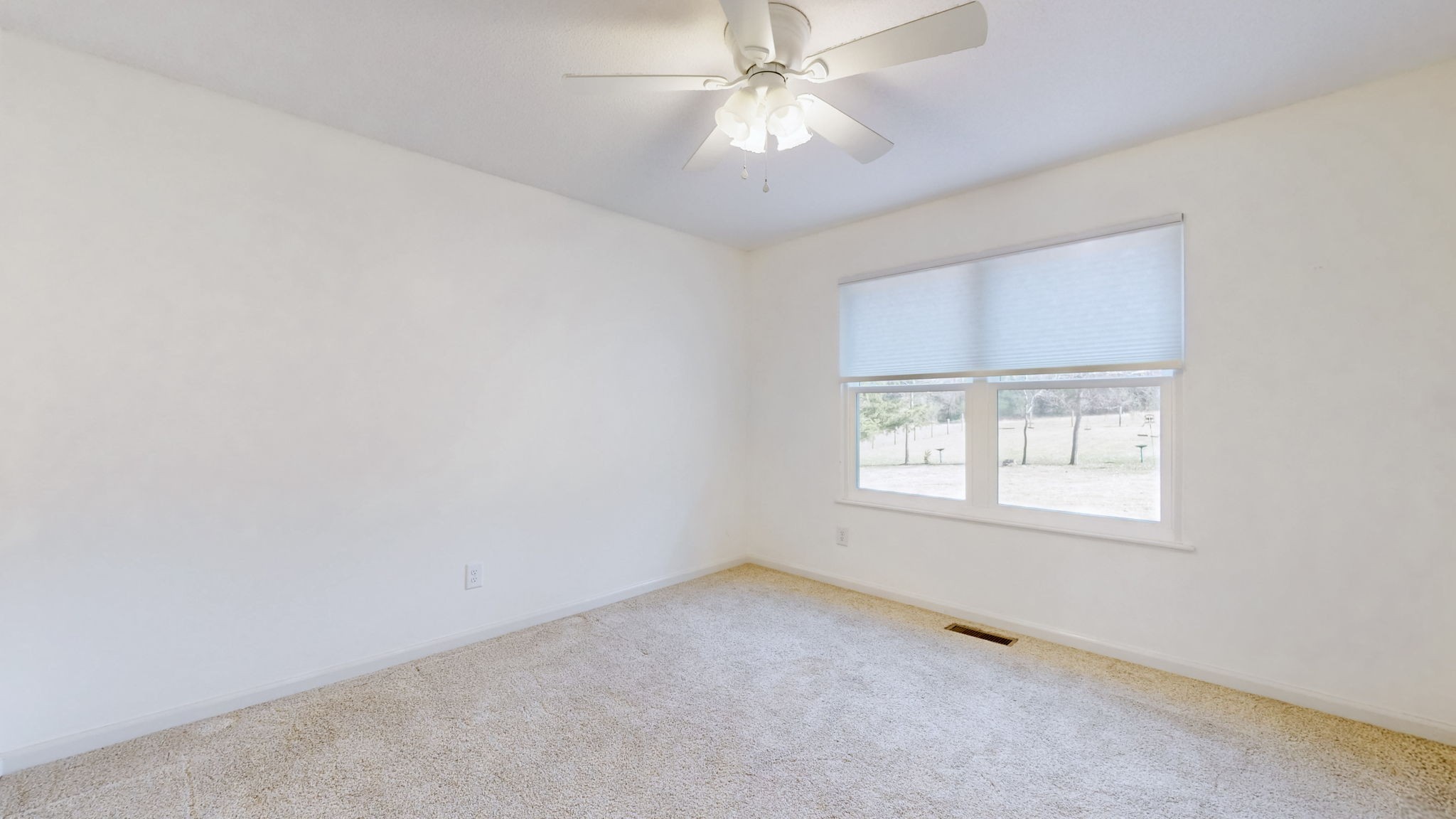 120 3 Fork Bridge Road Wartrace, TN 37183 - Photo 8 of 48 an empty room with a window and a fan