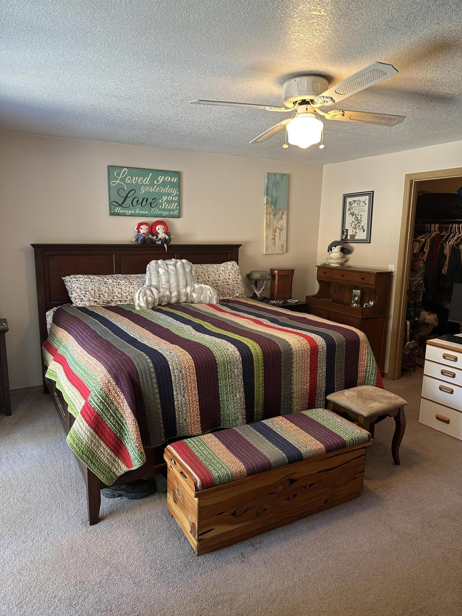 123977 Surveyor Road Crescent Lake, OR 97733 - Photo 34 of 41 a bedroom with bed and a chandelier