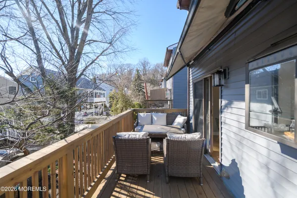 a view of balcony with furniture