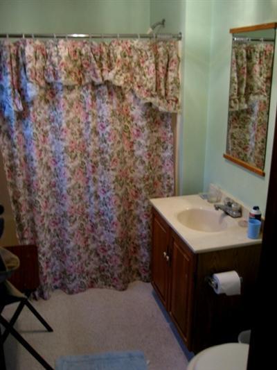 120 Pine Needle Road Wellfleet, MA 02667 - Photo 13 of 15 a bathroom with a sink and mirror