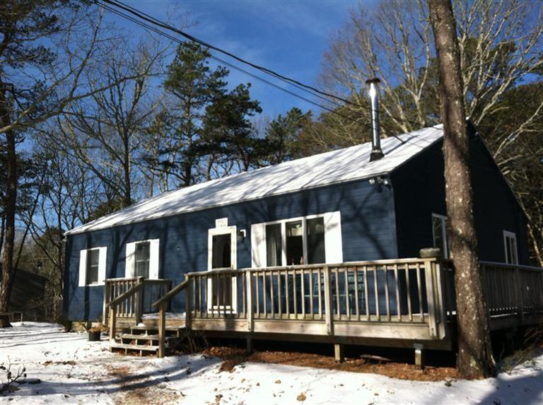 120 Pine Needle Road Wellfleet, MA 02667 - Photo 14 of 15 a front view of a house with a yard