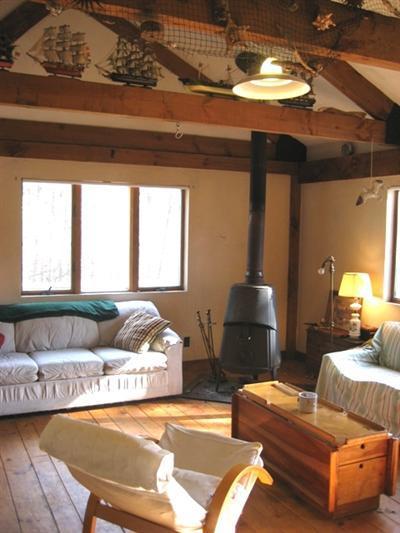 120 Pine Needle Road Wellfleet, MA 02667 - Photo 2 of 15 a living room with furniture and a window