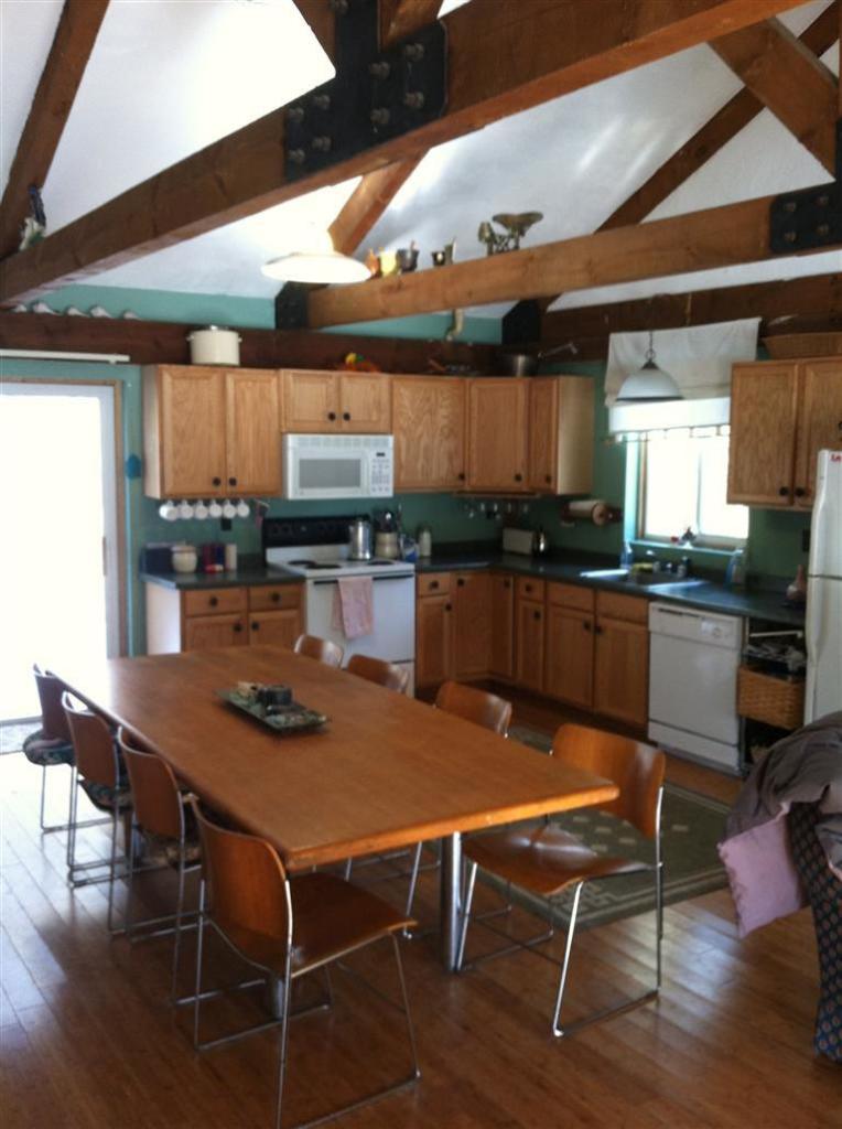 120 Pine Needle Road Wellfleet, MA 02667 - Photo 3 of 15 a dining table with chairs and wooden floor