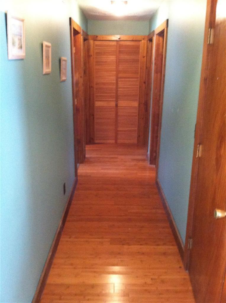 120 Pine Needle Road Wellfleet, MA 02667 - Photo 6 of 15 a view of a hallway with wooden floor