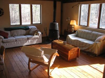120 Pine Needle Road Wellfleet, MA 02667 - Photo 8 of 15 a living room with furniture and a window