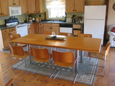 120 Pine Needle Road Wellfleet, MA 02667 - Photo 10 of 15 a view of a dining room with furniture and a window