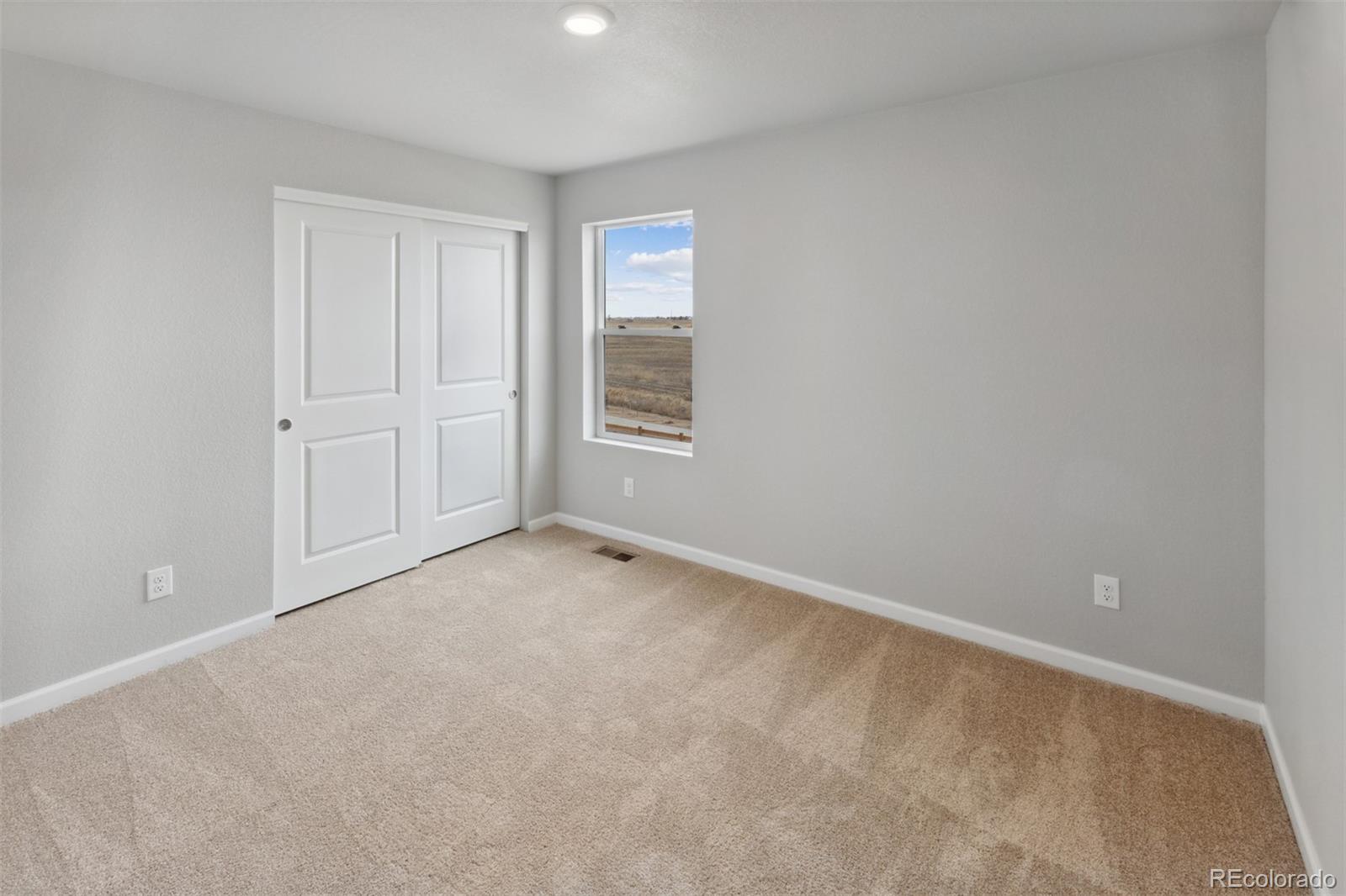 2181 Christina Street Fort Lupton, CO 80621 - Photo 14 of 39 a view of an empty room with a window