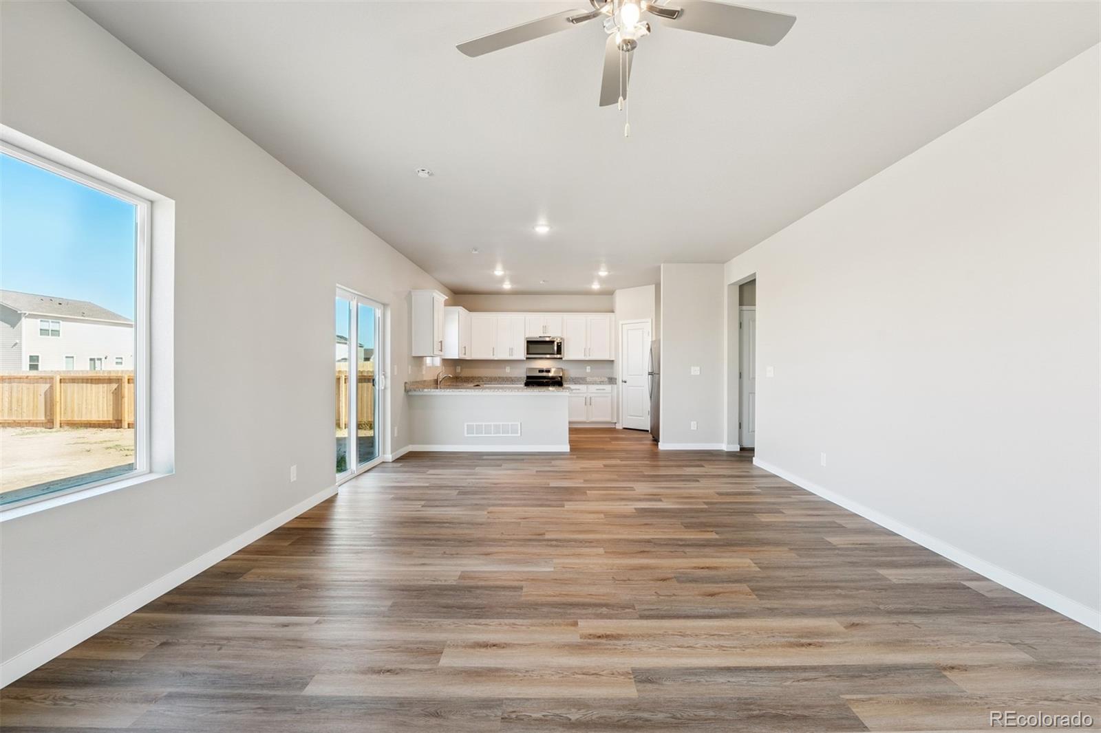 2181 Christina Street Fort Lupton, CO 80621 - Photo 6 of 39 a view of kitchen with wooden floor