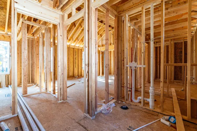 a view of a balcony with wooden floor and a tub