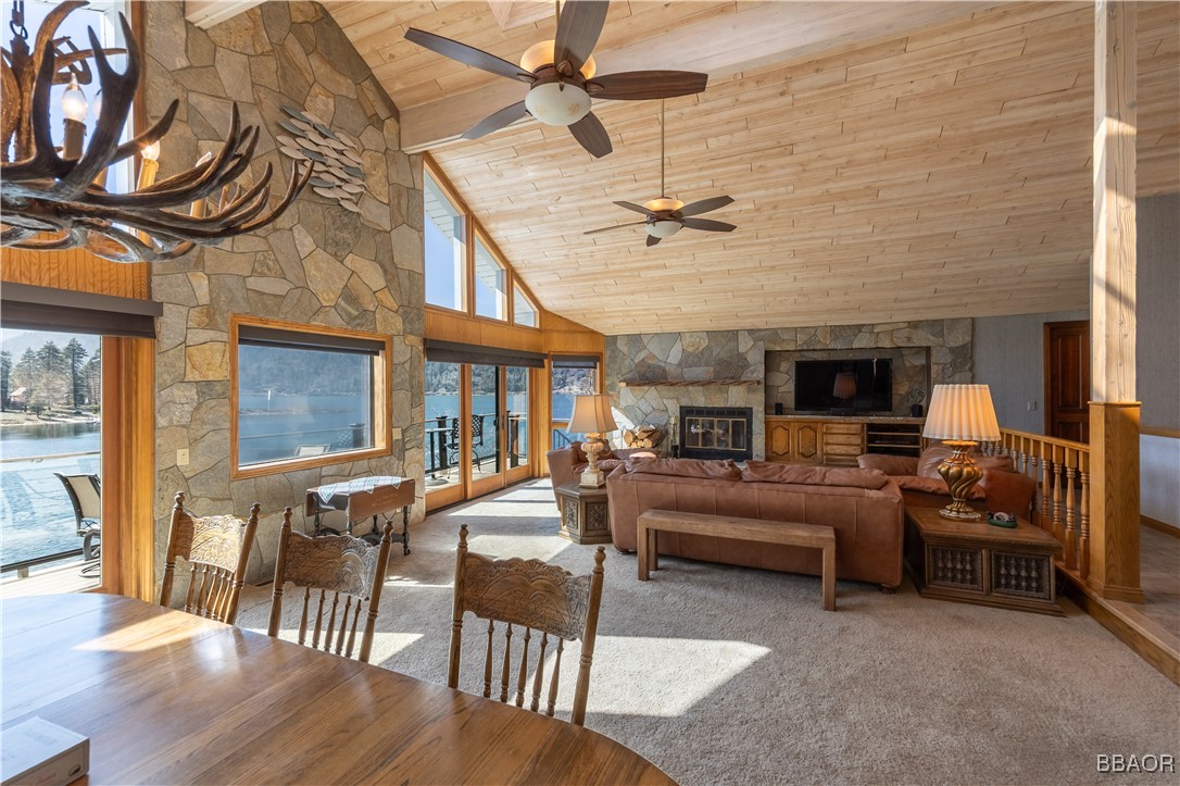 599 Cove Drive Big Bear Lake, CA 92315 - Photo 15 of 50 a living room with furniture ceiling fan and a rug