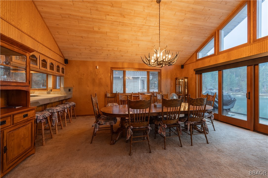 599 Cove Drive Big Bear Lake, CA 92315 - Photo 17 of 50 a view of a dining room with furniture window and wooden floor
