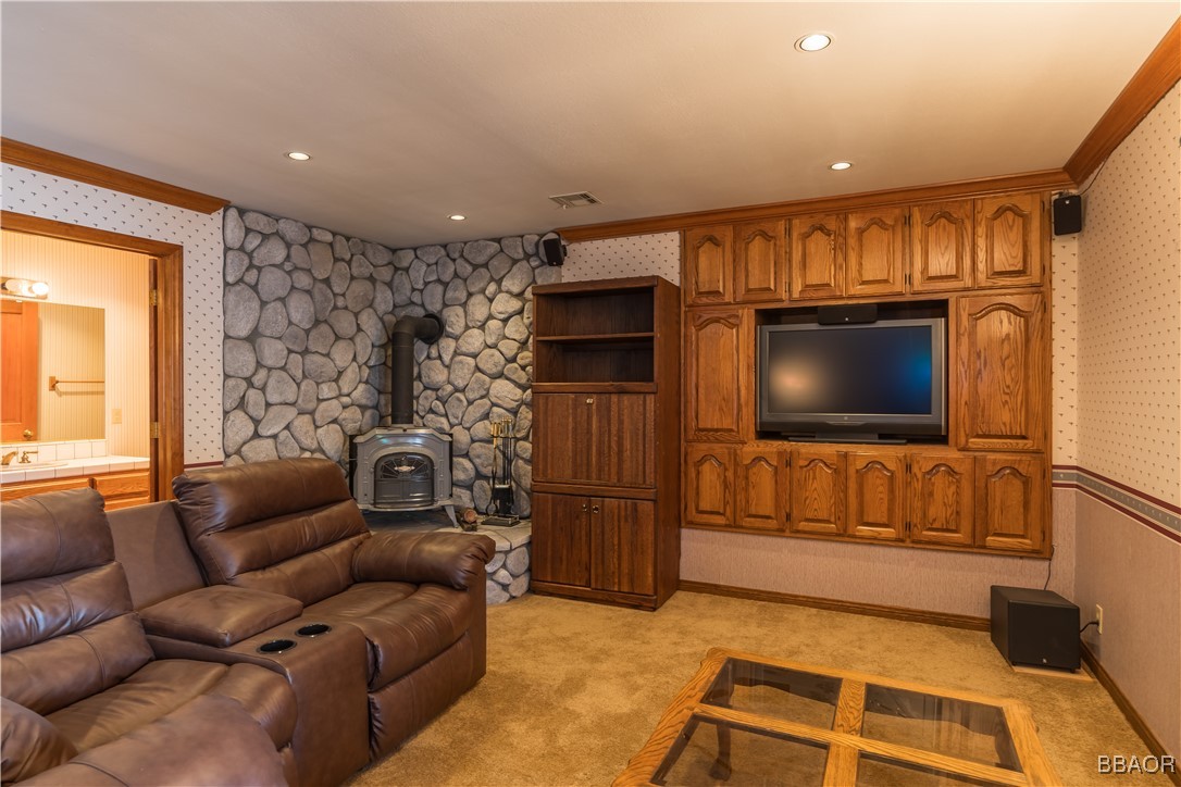 599 Cove Drive Big Bear Lake, CA 92315 - Photo 19 of 50 a living room with furniture and a flat screen tv