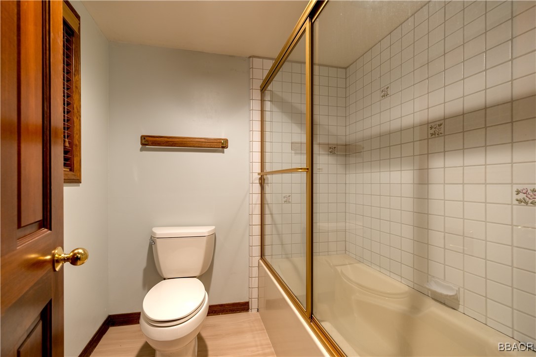 599 Cove Drive Big Bear Lake, CA 92315 - Photo 29 of 50 a white toilet sitting next to a bath tub