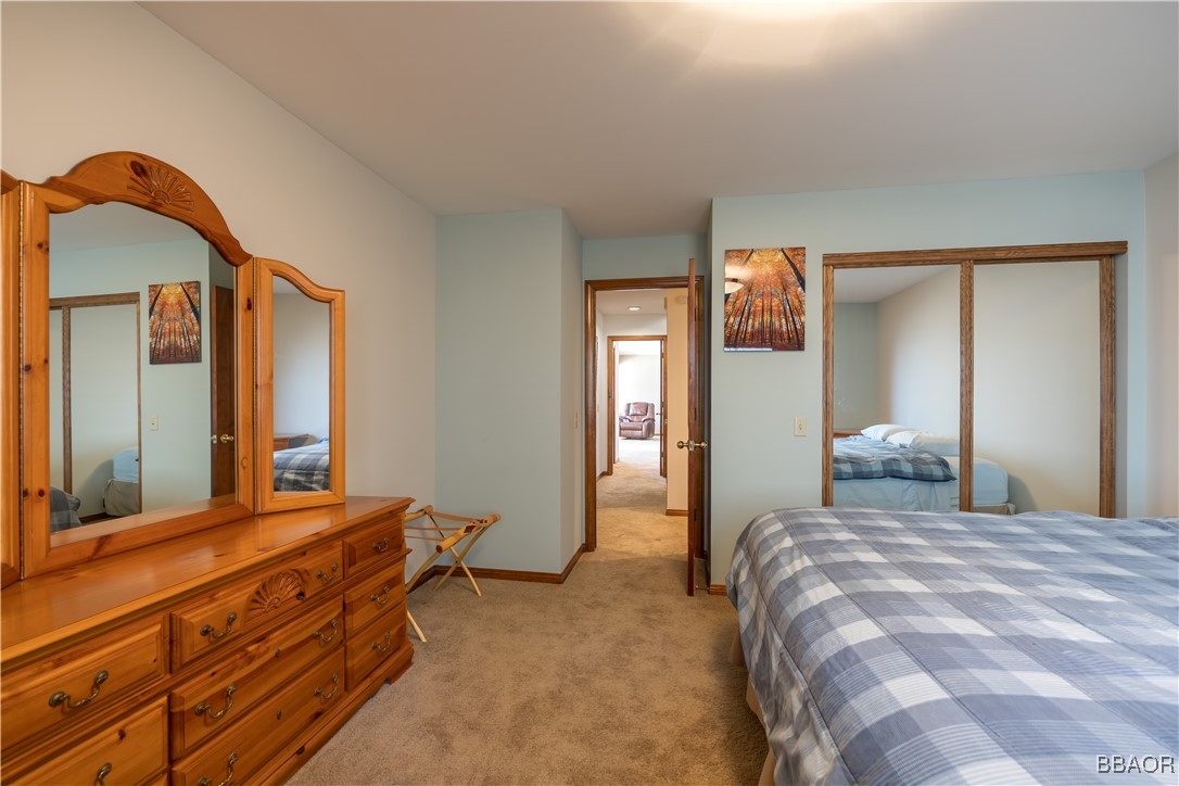 599 Cove Drive Big Bear Lake, CA 92315 - Photo 30 of 50 a bedroom with a bed and a dresser