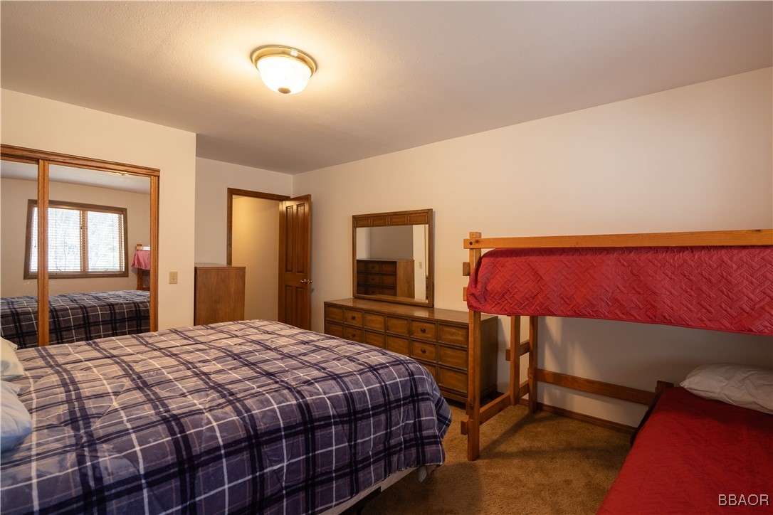 599 Cove Drive Big Bear Lake, CA 92315 - Photo 39 of 50 a bedroom with a bed and window