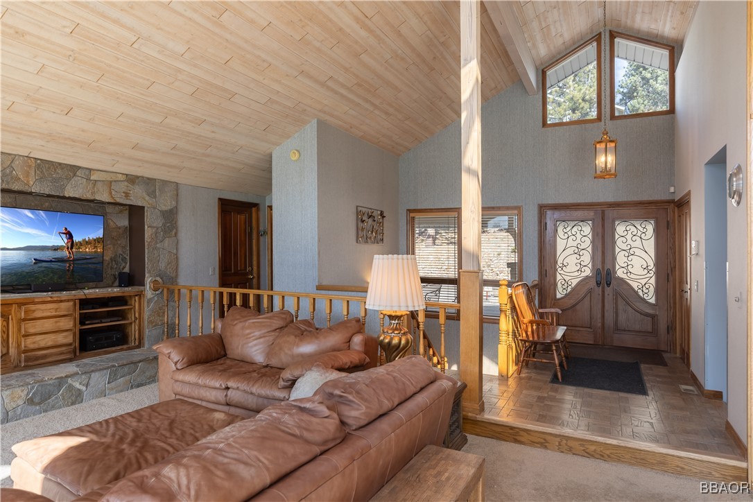599 Cove Drive Big Bear Lake, CA 92315 - Photo 6 of 50 a living room with furniture and a flat screen tv