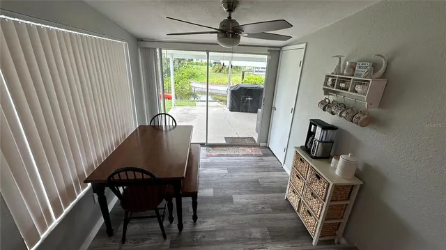 a dining room with furniture and window