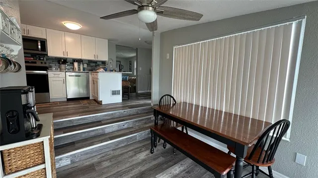 a view of kitchen with sink microwave and stove
