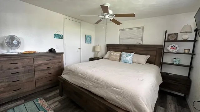 a bedroom with a bed and a dresser