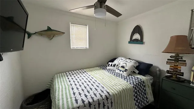 a bedroom with a bed and a chair