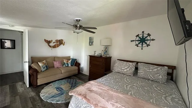 a bedroom with a bed and a couch