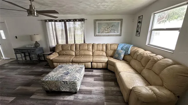 a living room with furniture and a window