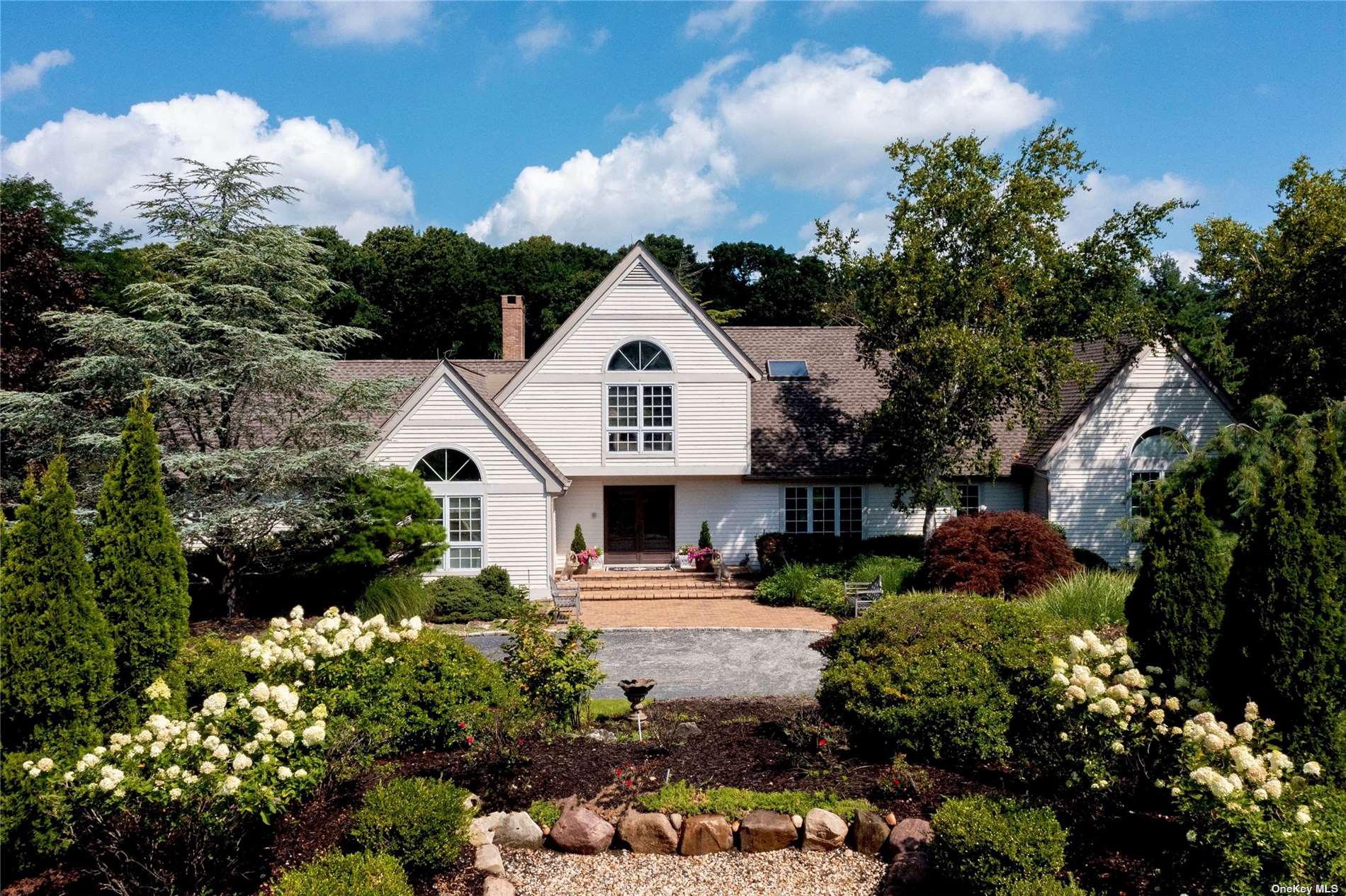 19 The Chase St. James, NY 11780 - Photo 1 of 1 a view of a house with a big yard plants and large trees