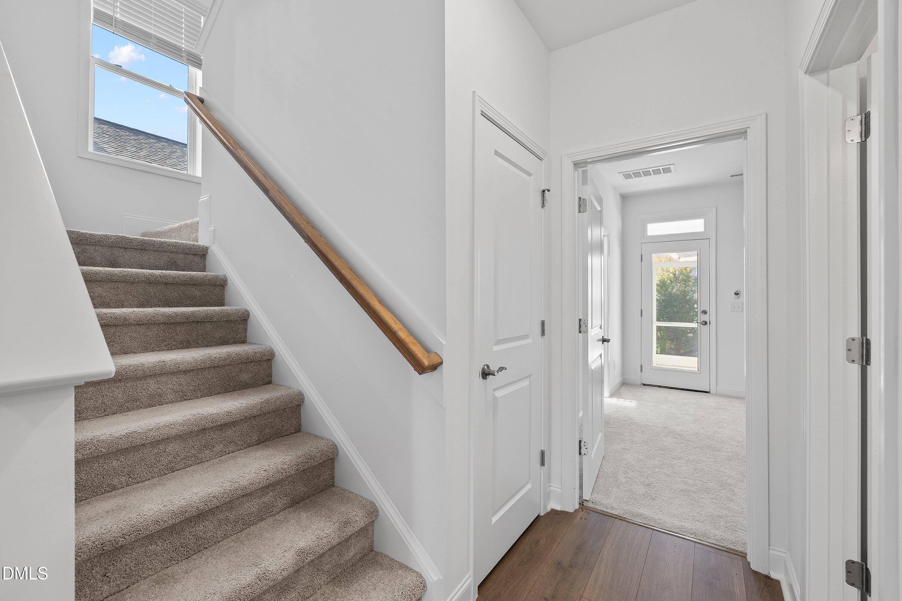115 Swain Street Clayton, NC 27527 - Photo 18 of 46 a view of entryway with wooden floor and stairs