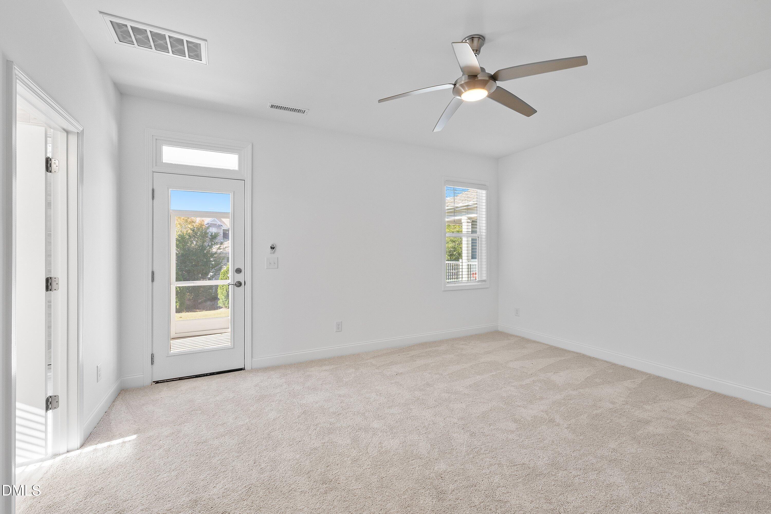 115 Swain Street Clayton, NC 27527 - Photo 20 of 46 a view of an empty room with a window