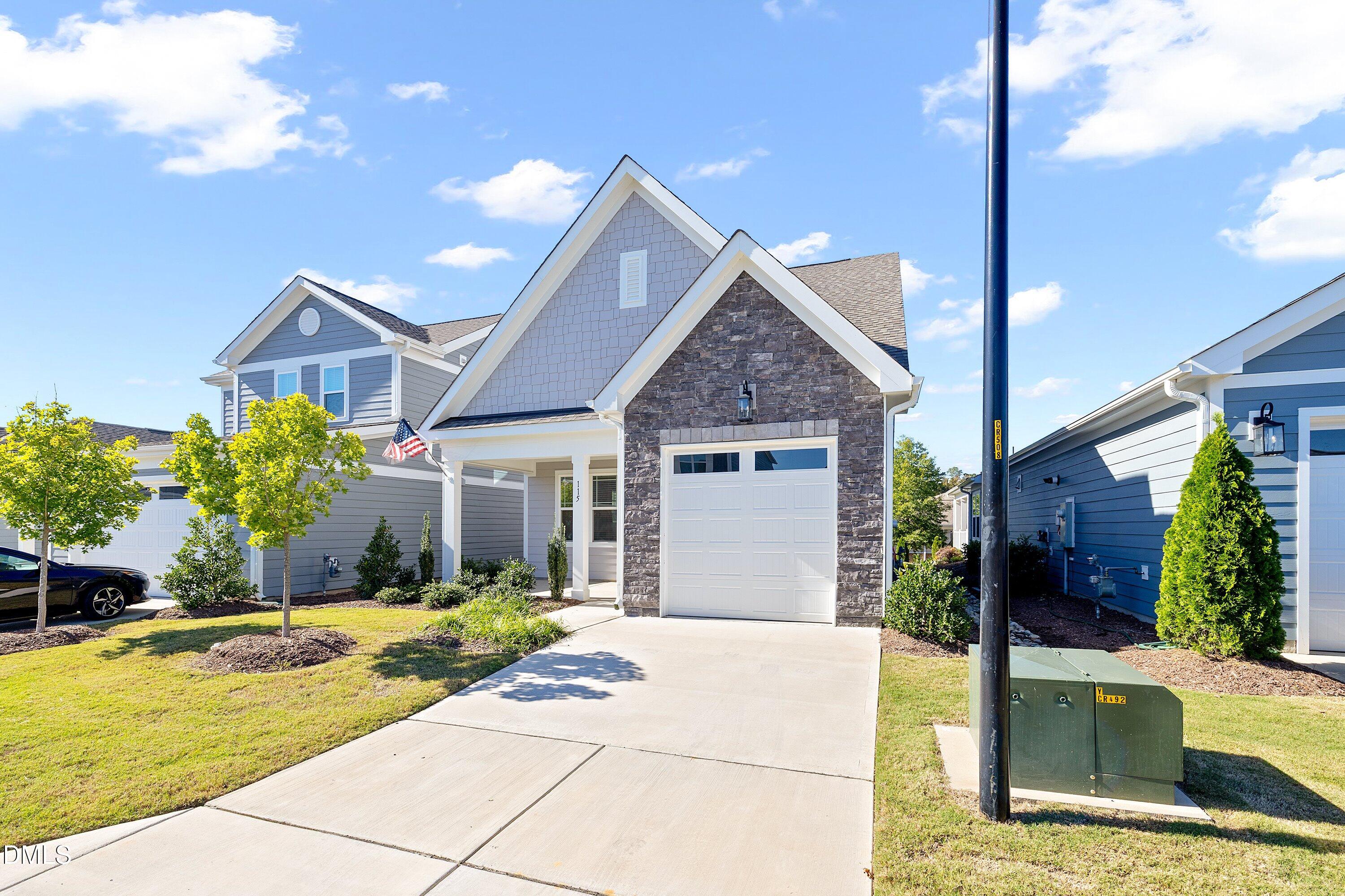 115 Swain Street Clayton, NC 27527 - Photo 2 of 46 a front view of a house with garden