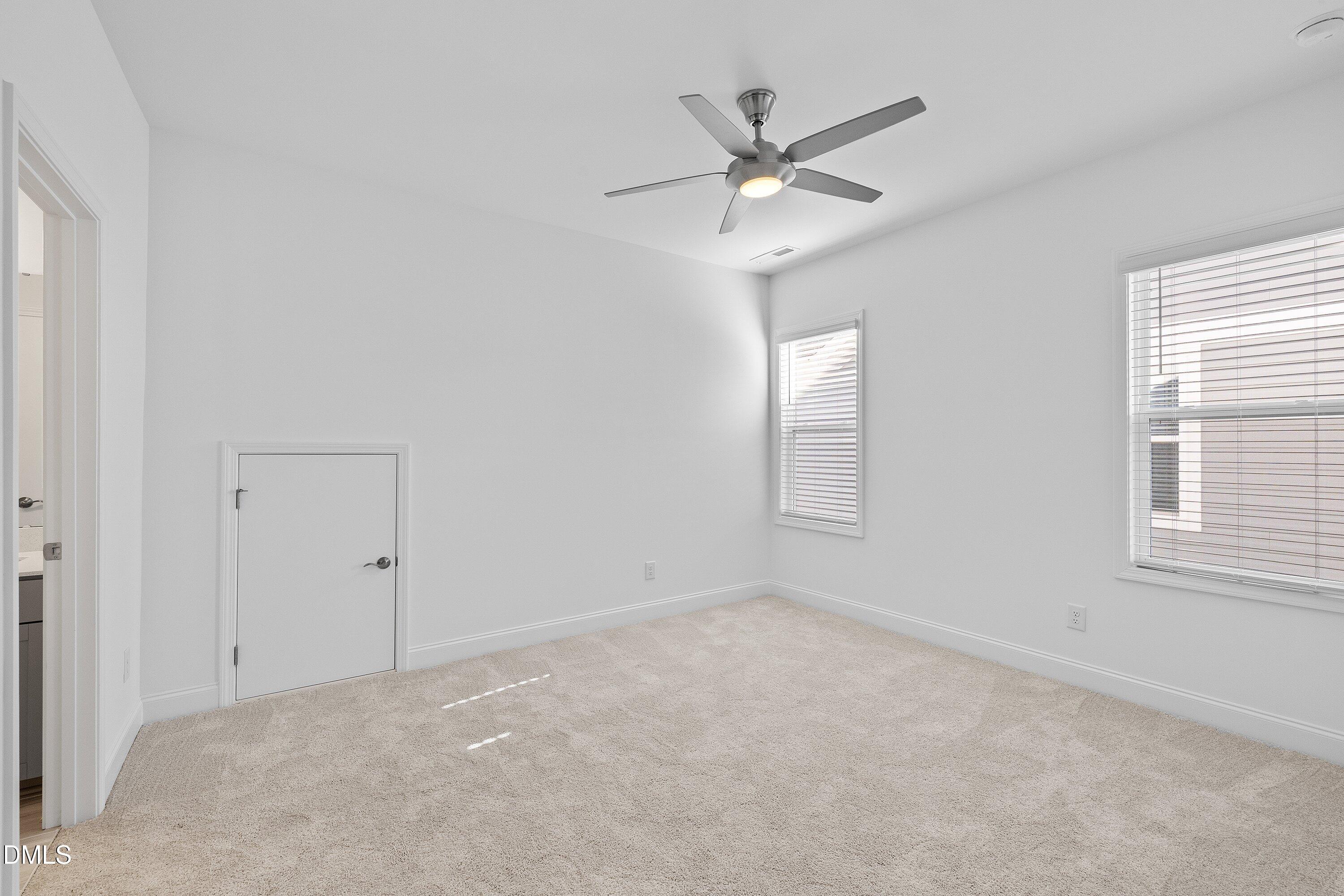 115 Swain Street Clayton, NC 27527 - Photo 32 of 46 an empty room with a window and a fan