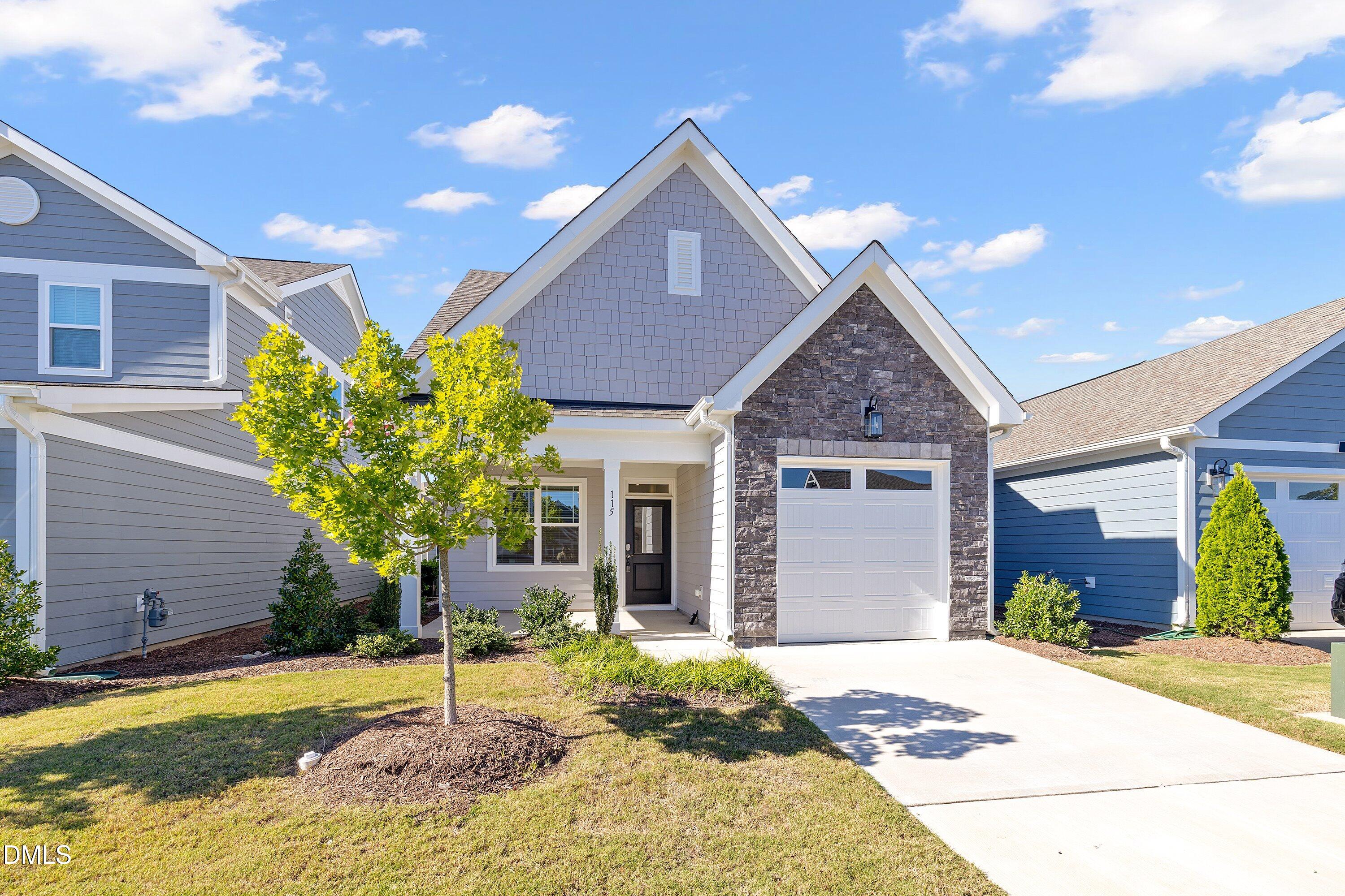 115 Swain Street Clayton, NC 27527 - Photo 4 of 46 a front view of a house with garden