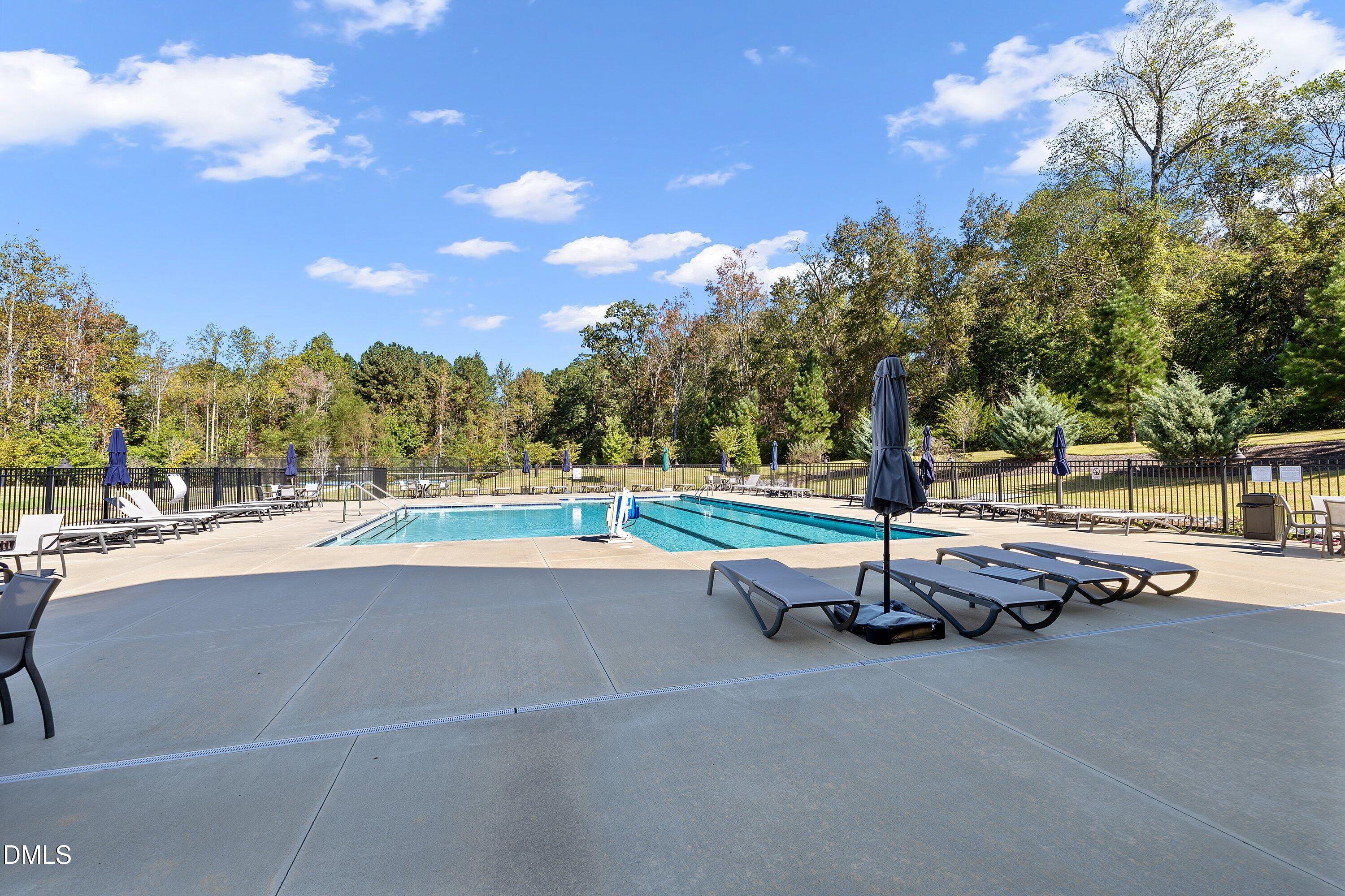 115 Swain Street Clayton, NC 27527 - Photo 42 of 46 a view of a swimming pool with a patio