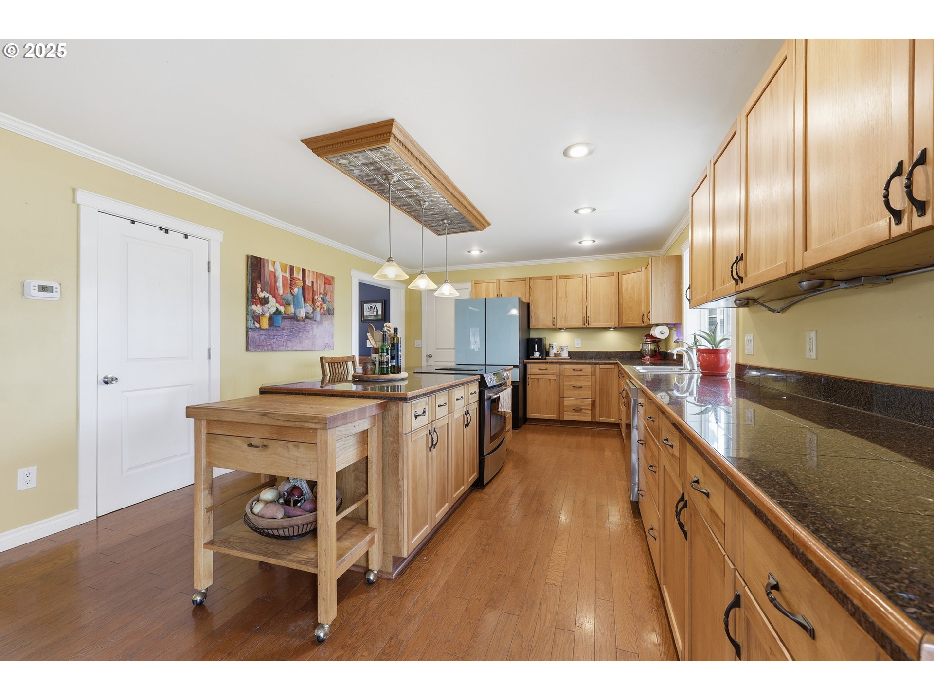 54472 Smock Road Tygh Valley, OR 97063 - Photo 13 of 48 a open kitchen with stainless steel appliances kitchen island granite countertop a sink and cabinets