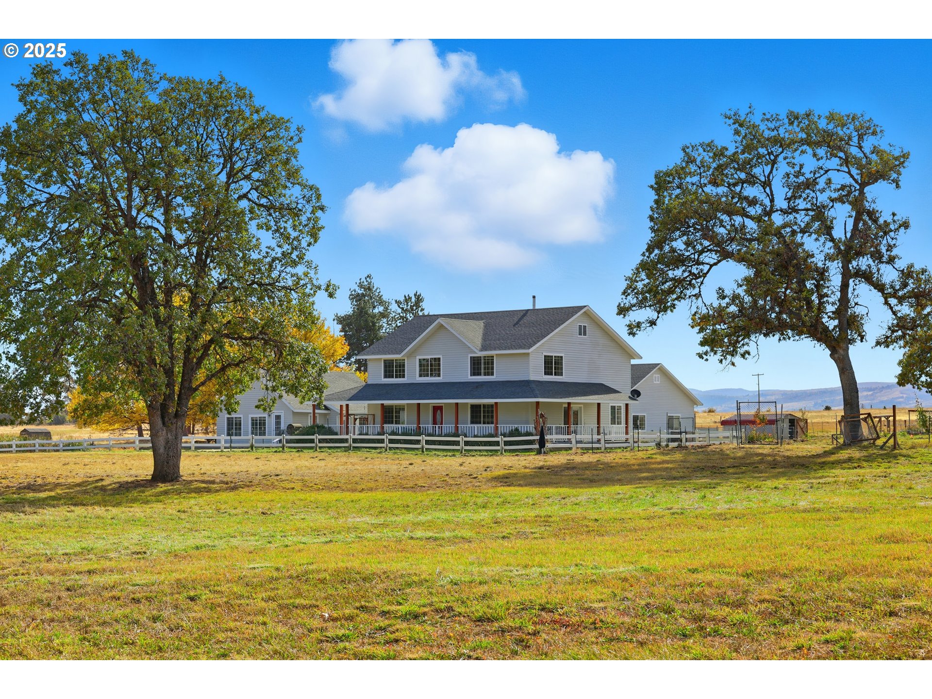 54472 Smock Road Tygh Valley, OR 97063 - Photo 35 of 48 a house view with swimming pool and trees in the background