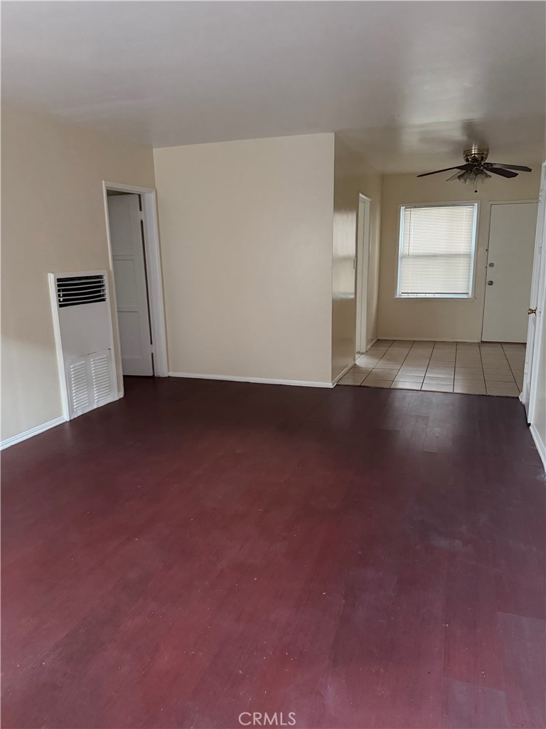1925 West 35th Street Los Angeles, CA 90018 - Photo 4 of 11 an empty room with wooden floor and windows