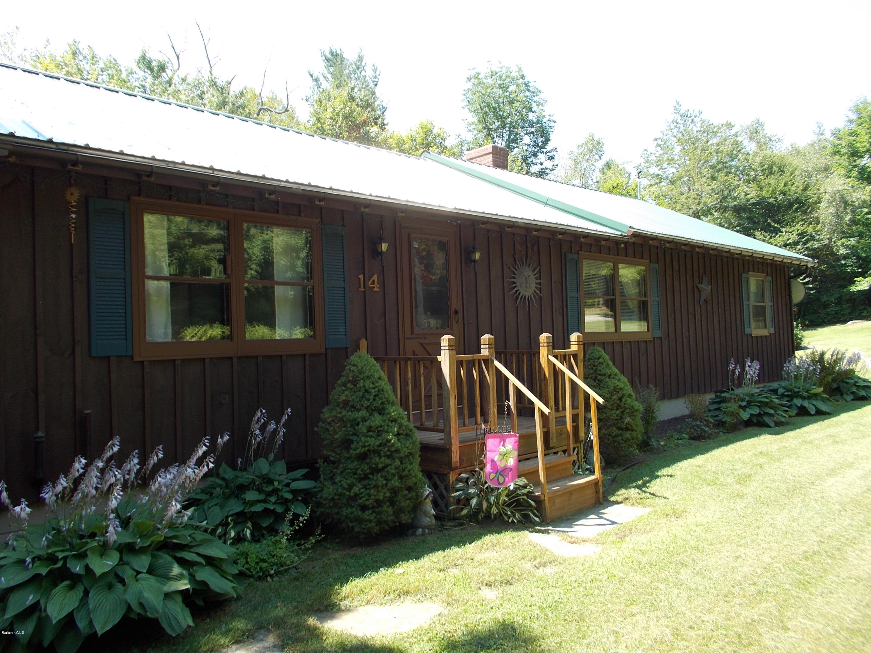 14 Arthur Pease Road Middlefield, MA 01011 - Photo 22 of 23 a view of a house with a yard and potted plants
