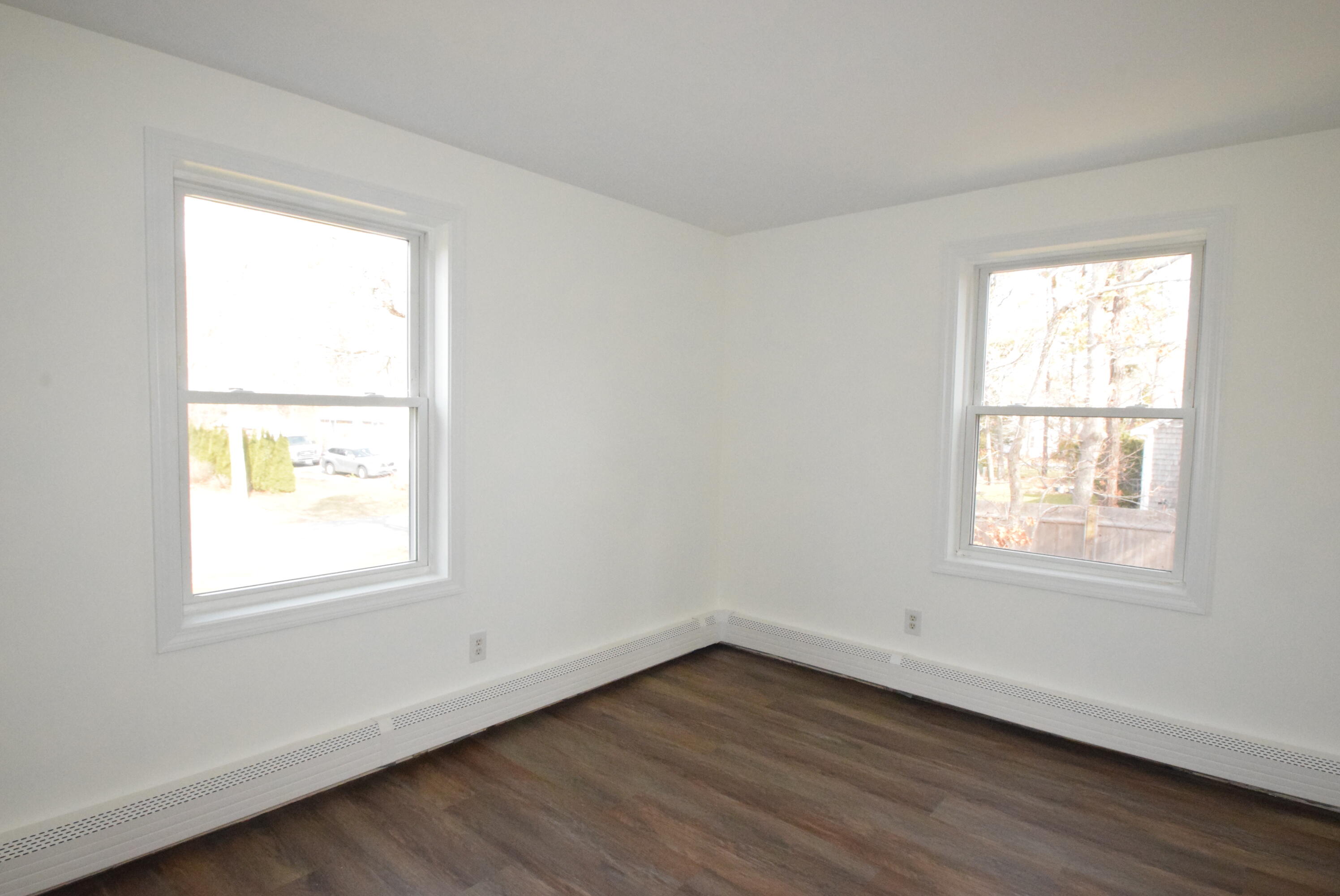 26 Ryder Road Harwich, MA 02645 - Photo 13 of 34 a view of an empty room with wooden floor and a window