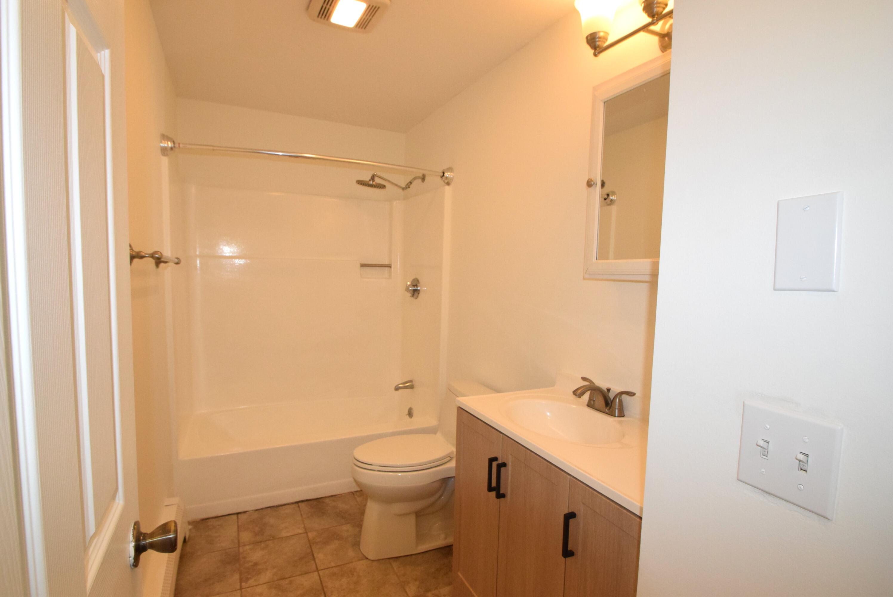 26 Ryder Road Harwich, MA 02645 - Photo 15 of 34 a bathroom with a sink a toilet and shower