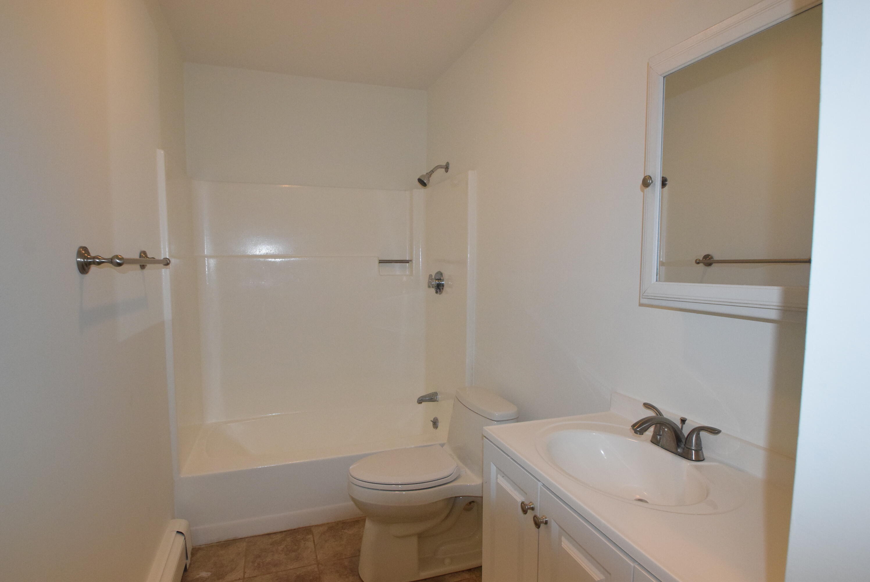 26 Ryder Road Harwich, MA 02645 - Photo 21 of 34 a bathroom with a sink a toilet and shower