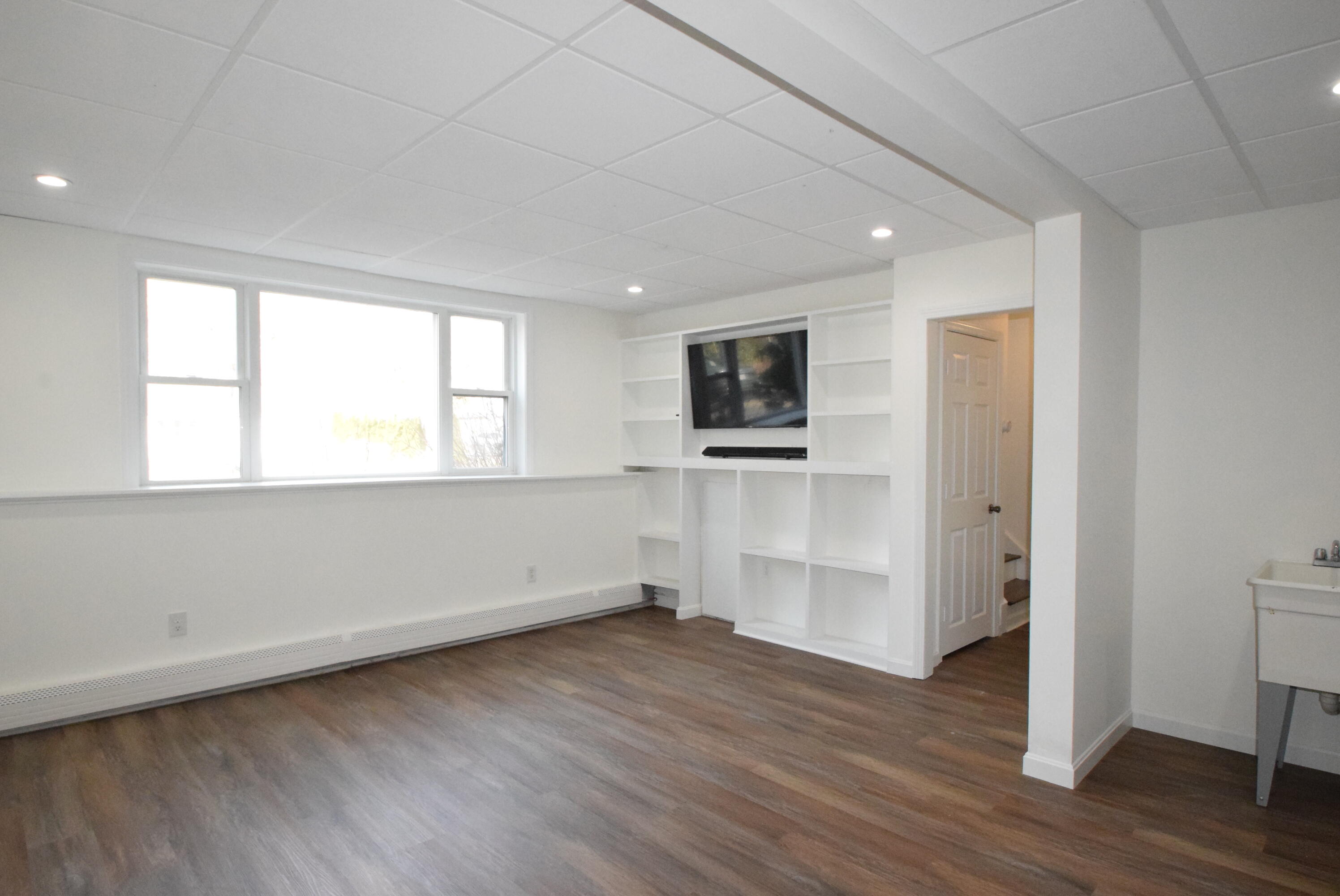 26 Ryder Road Harwich, MA 02645 - Photo 22 of 34 a view of empty room with wooden floor and fan