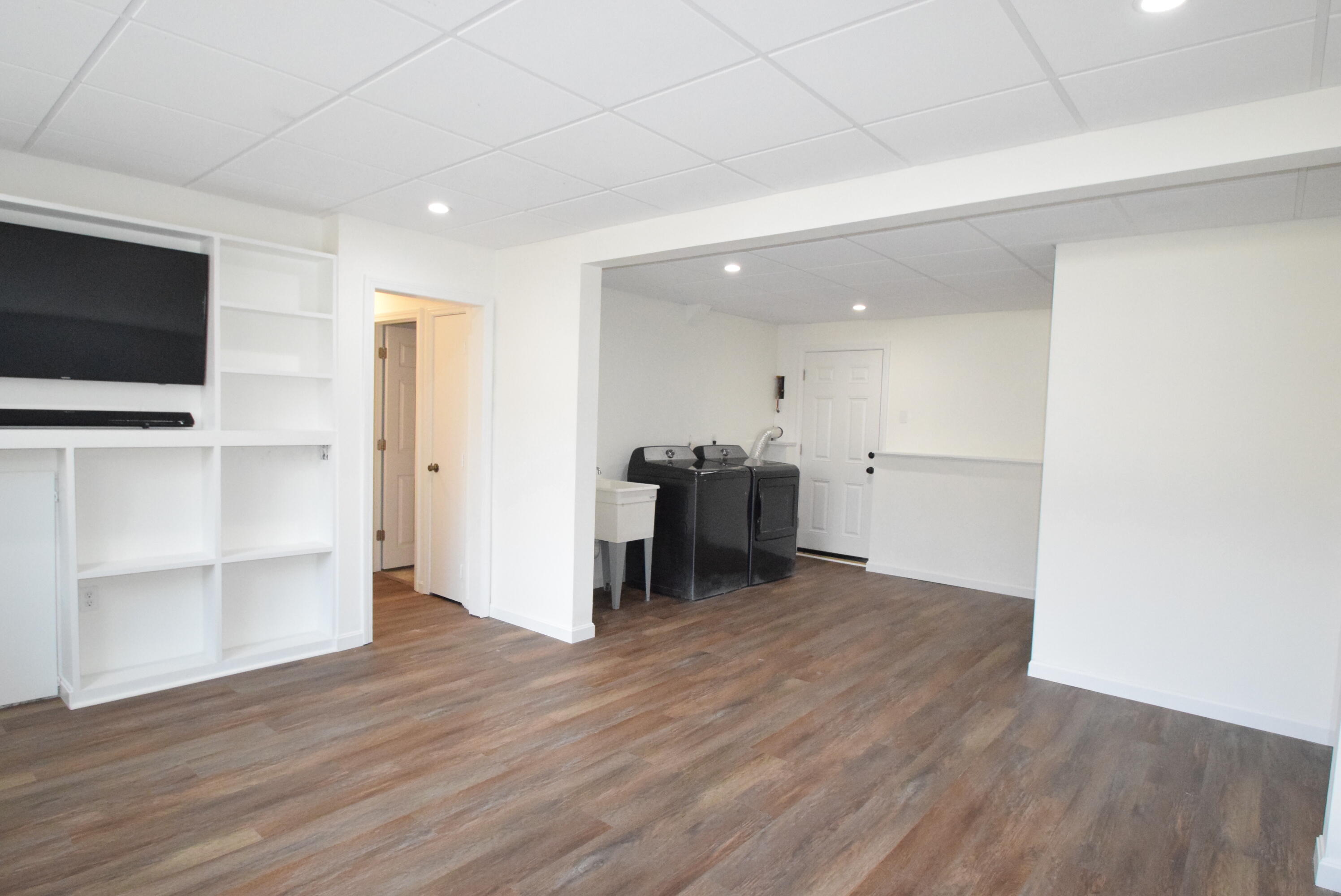 26 Ryder Road Harwich, MA 02645 - Photo 25 of 34 a view of a big room with wooden floor and furniture