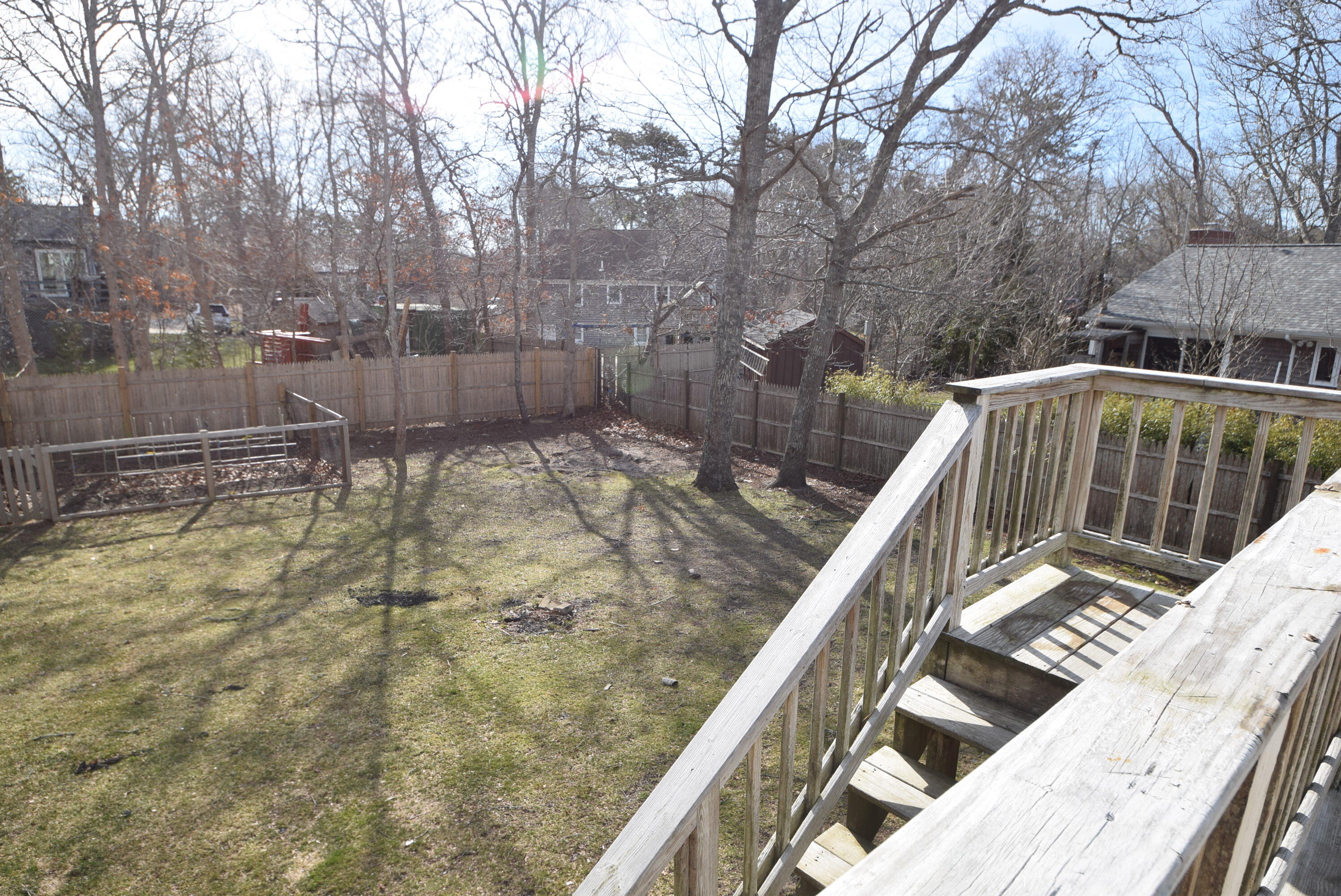 26 Ryder Road Harwich, MA 02645 - Photo 30 of 34 a balcony with trees in front of it