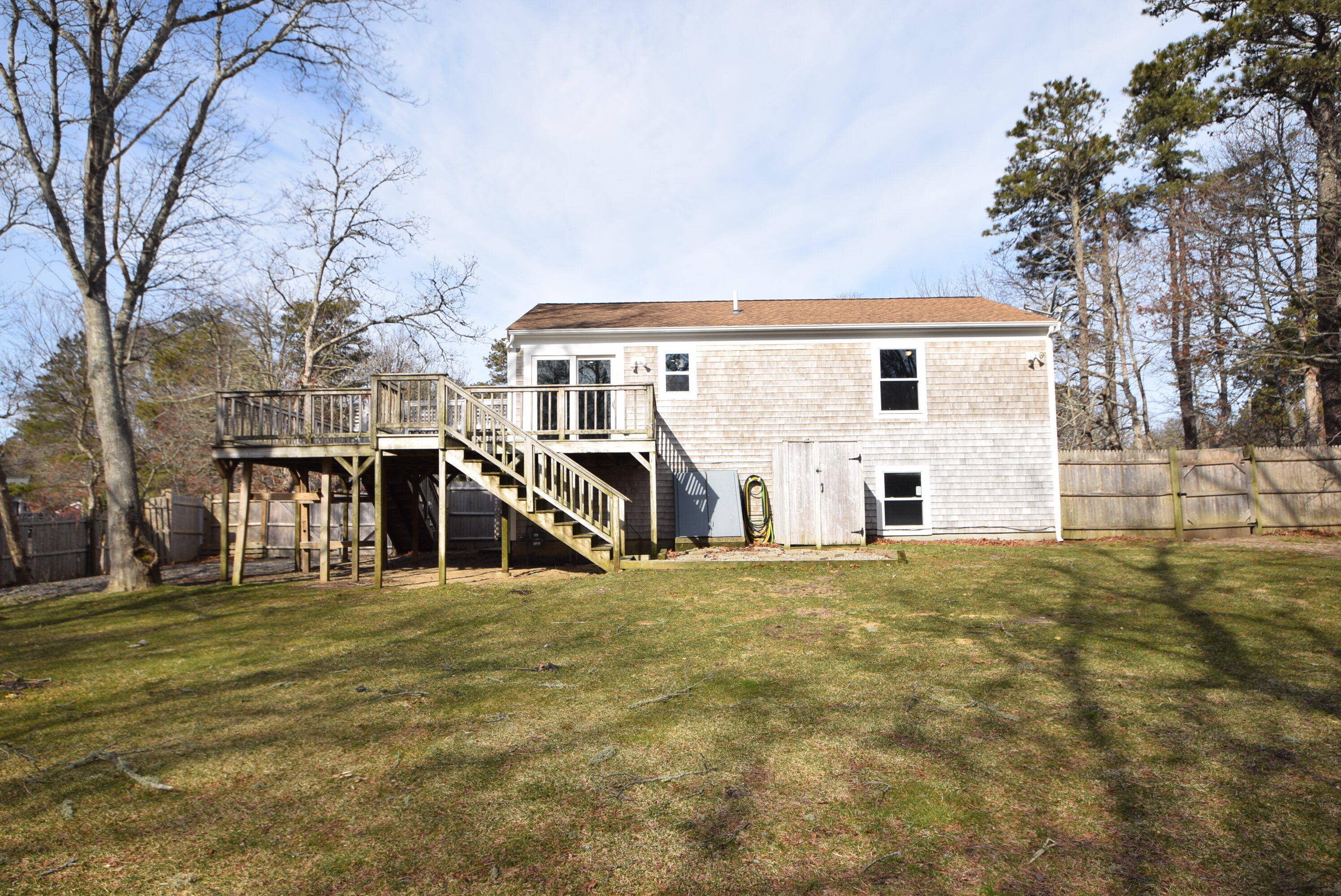 26 Ryder Road Harwich, MA 02645 - Photo 31 of 34 a view of a house with a yard