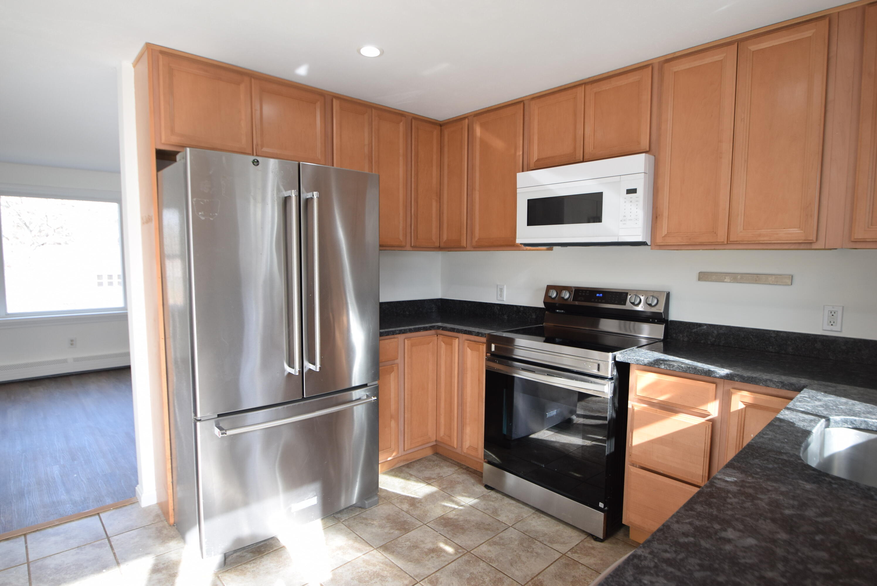26 Ryder Road Harwich, MA 02645 - Photo 6 of 34 a kitchen with stainless steel appliances granite countertop a refrigerator sink and stove